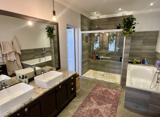 Enjoy modern estate living in this stylish 3-bedro...